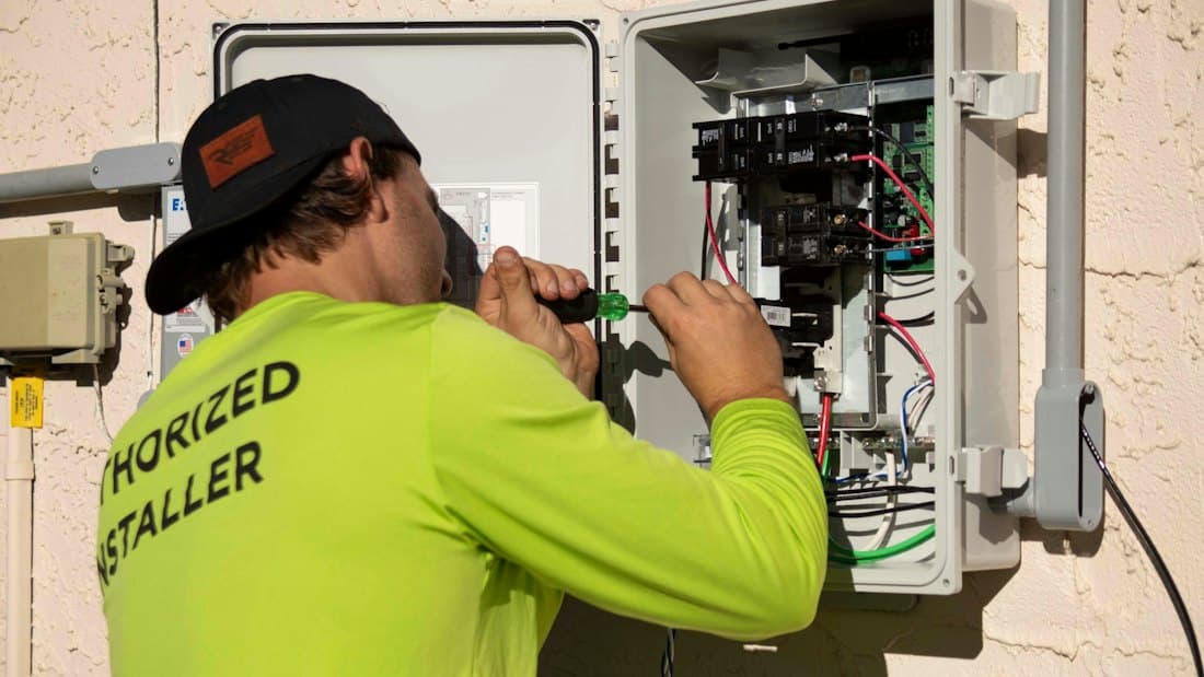 Installer wiring an electrical panel